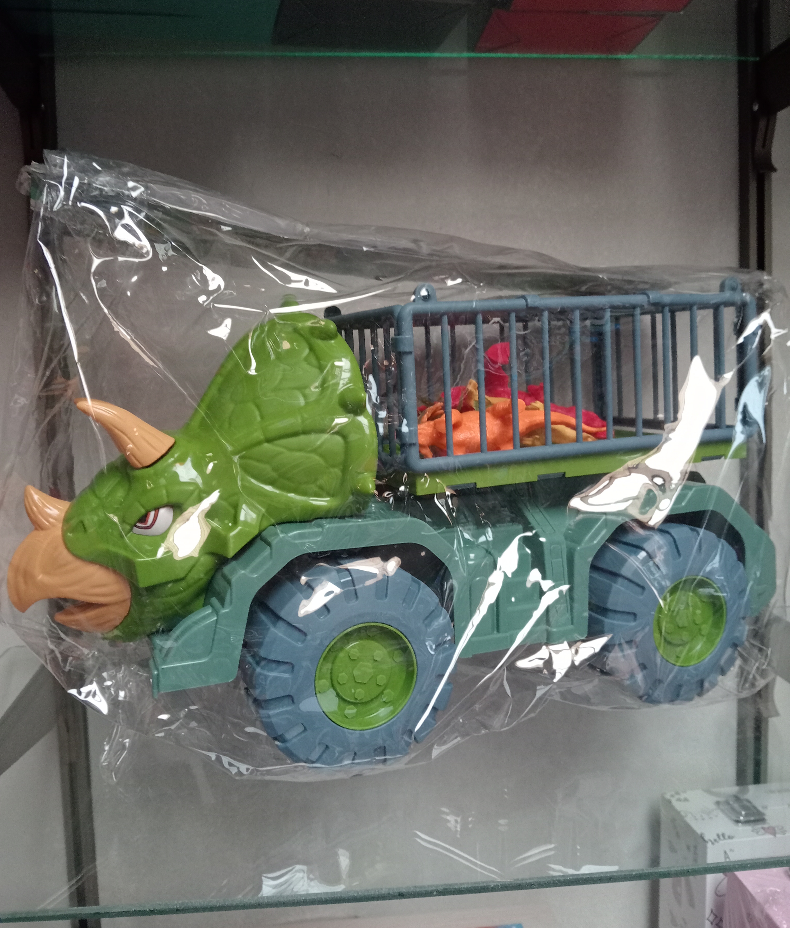 CAMION JAULA DINOSAURIO